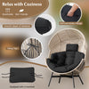 Oversized black wicker egg chair with thick cushions and headrest, designed for comfort in backyard or living room.