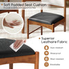Soft padded seat cushion of a wooden dining chair, featuring stain-resistant faux leather for comfort and durability.