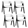 Set of 4 mid-century modern dining chairs with black wood frames and white faux sherpa upholstery for stylish comfort.
