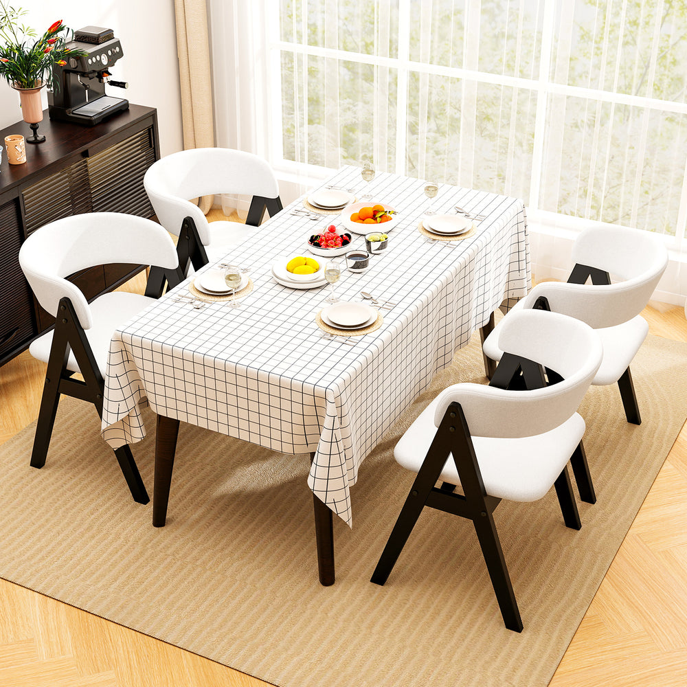Mid-century modern dining chair set of 4 in black with soft white faux sherpa upholstery for stylish dining rooms.