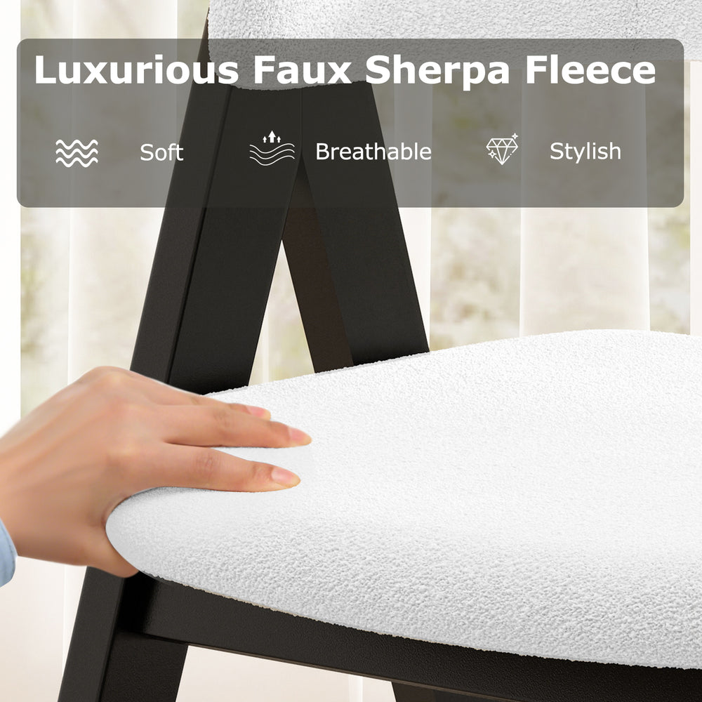 White faux sherpa upholstered dining chair showcasing soft, breathable fabric and a sturdy black wooden frame for.
