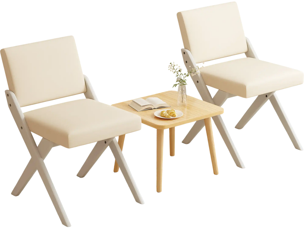 Two white padded dining chairs with rubber wood frames and a small wooden table, perfect for modern farmhouse.