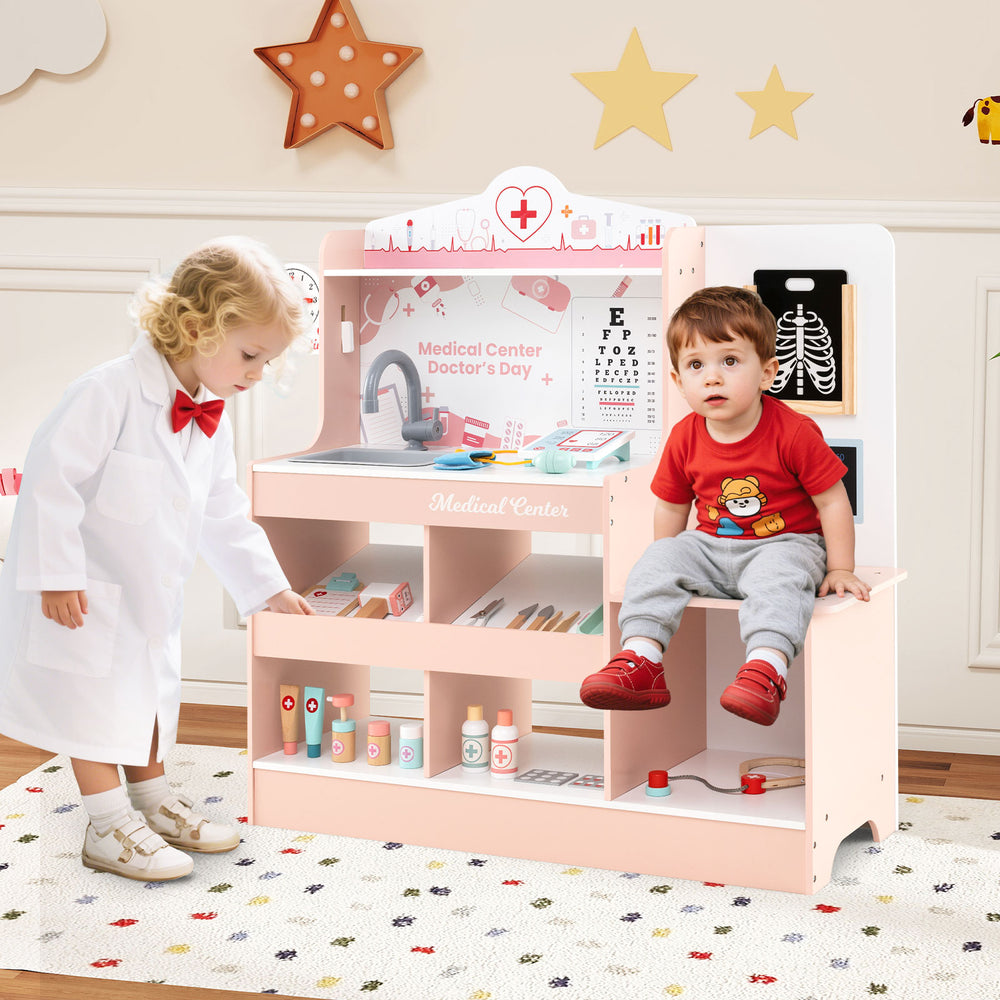 Wooden doctor playset in pink with a child playing, featuring shelves, stethoscope, and 24 medical accessories for.