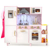 Wooden kitchen playset in pink with ice maker, lights, and sounds, designed for imaginative play for ages 3 and up.