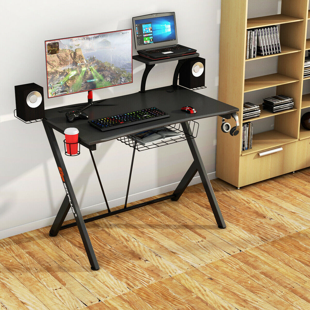 K-shaped gaming desk with wire management tray, headphone hook, and spacious diamond-patterned PVC surface for gamers.