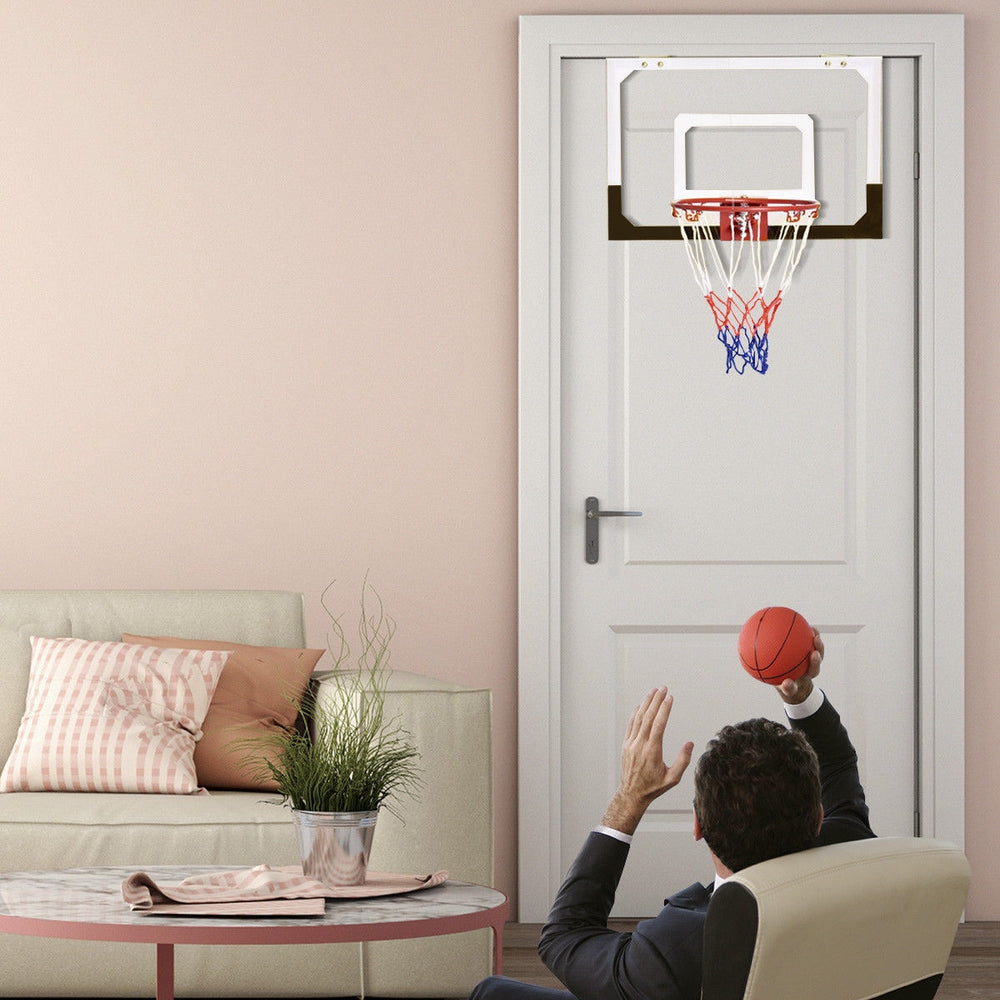 Over-the-door mini basketball hoop with 18" shatterproof backboard, includes rubber basketball for indoor fun.